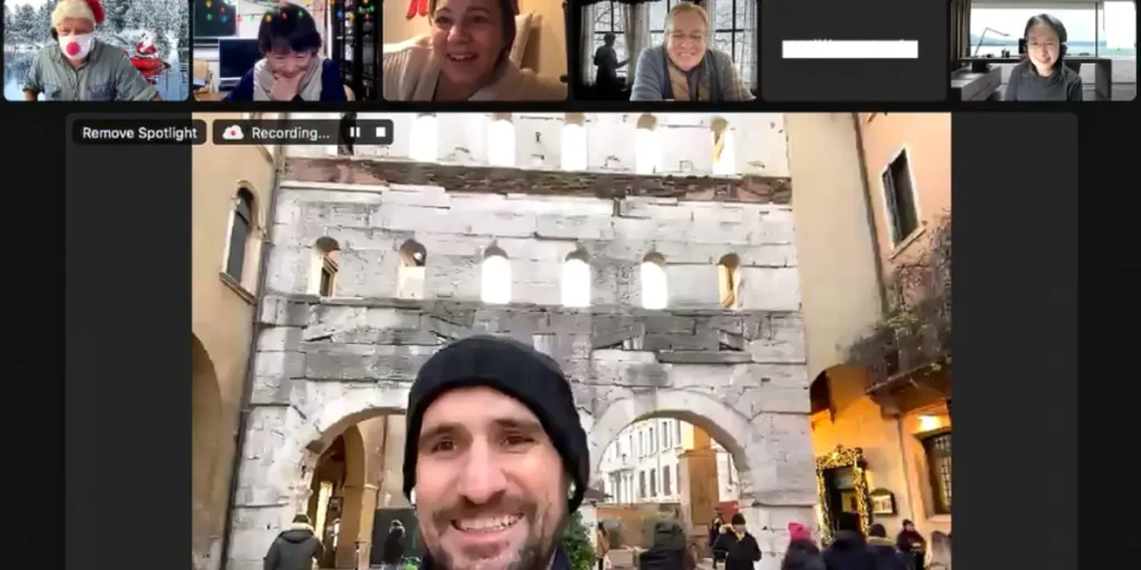 Screenshot of a past LiveWalks tour showing the tour host on a large Zoom screen, with participants in smaller thumbnails.