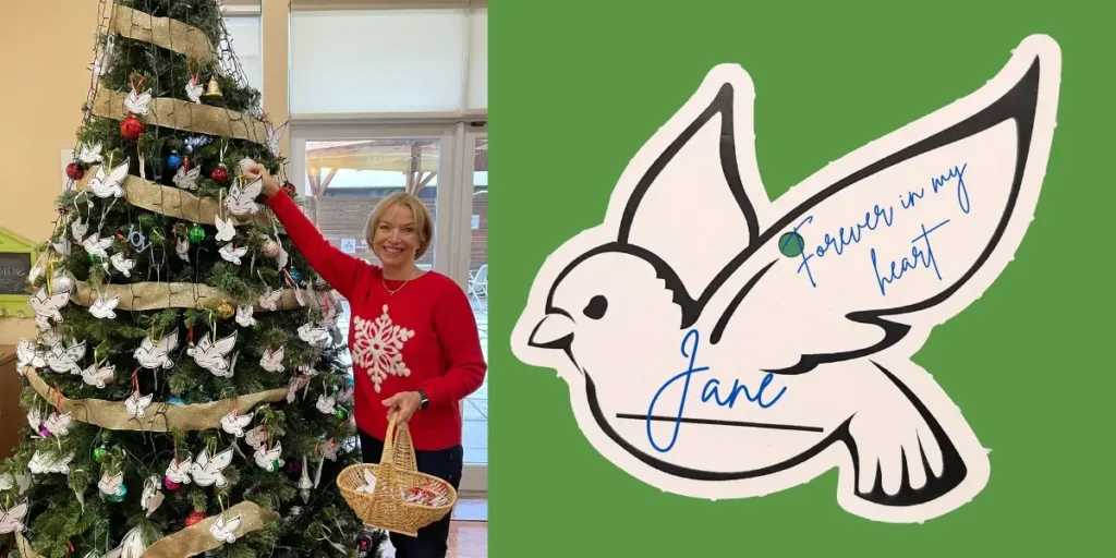 An image of a hospice volunteer adding dove ornaments to our residence holiday tree.