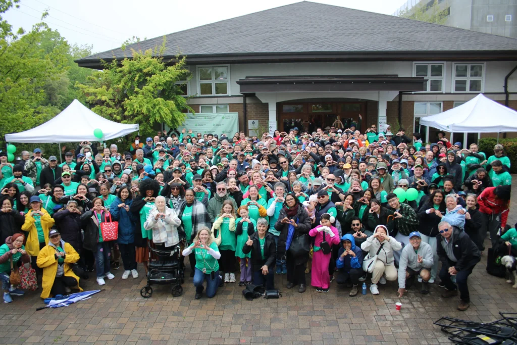 a group photo of the 2026 jack cooper hike for hospice participants taken in front of dorothy ley hospice
